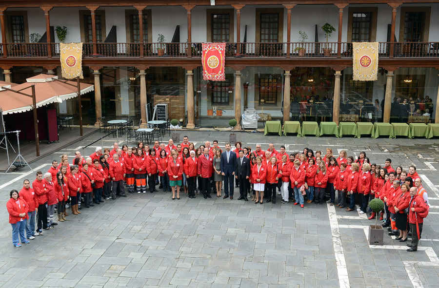 TRH the Prince and the Princess of Asturias with voluntary workers of the International Red Cross and Red Crescent Movement in Oviedo